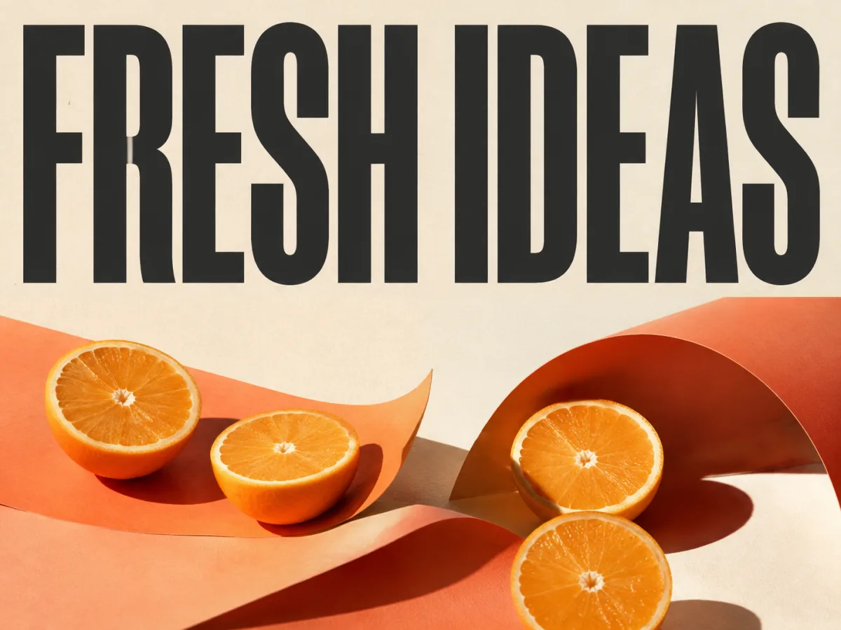 FRESH IDEAS poster with orange halves and coral paper on an ivory background